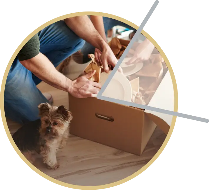 Man unpacking moving boxes in a new home with a small dog, symbolizing a fresh start.